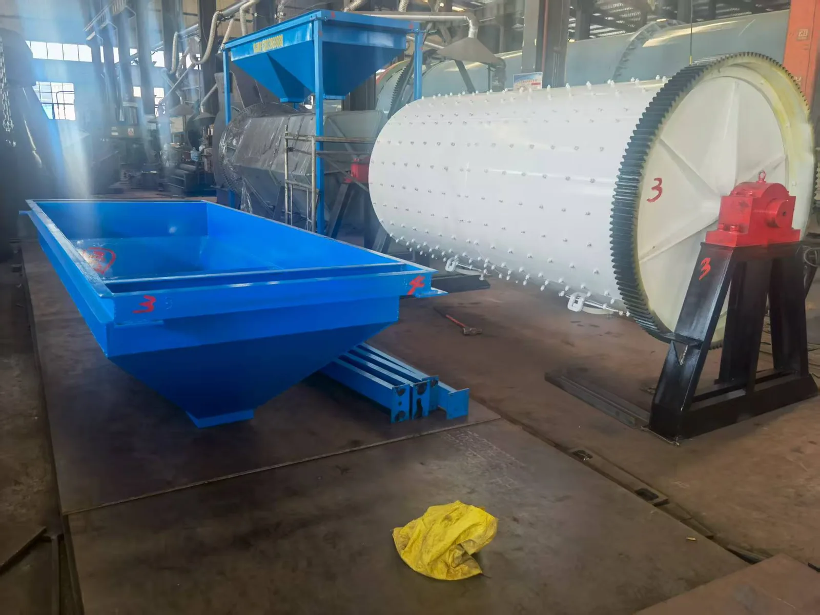 Completed industrial rotary drum stone polishing unit in the workshop