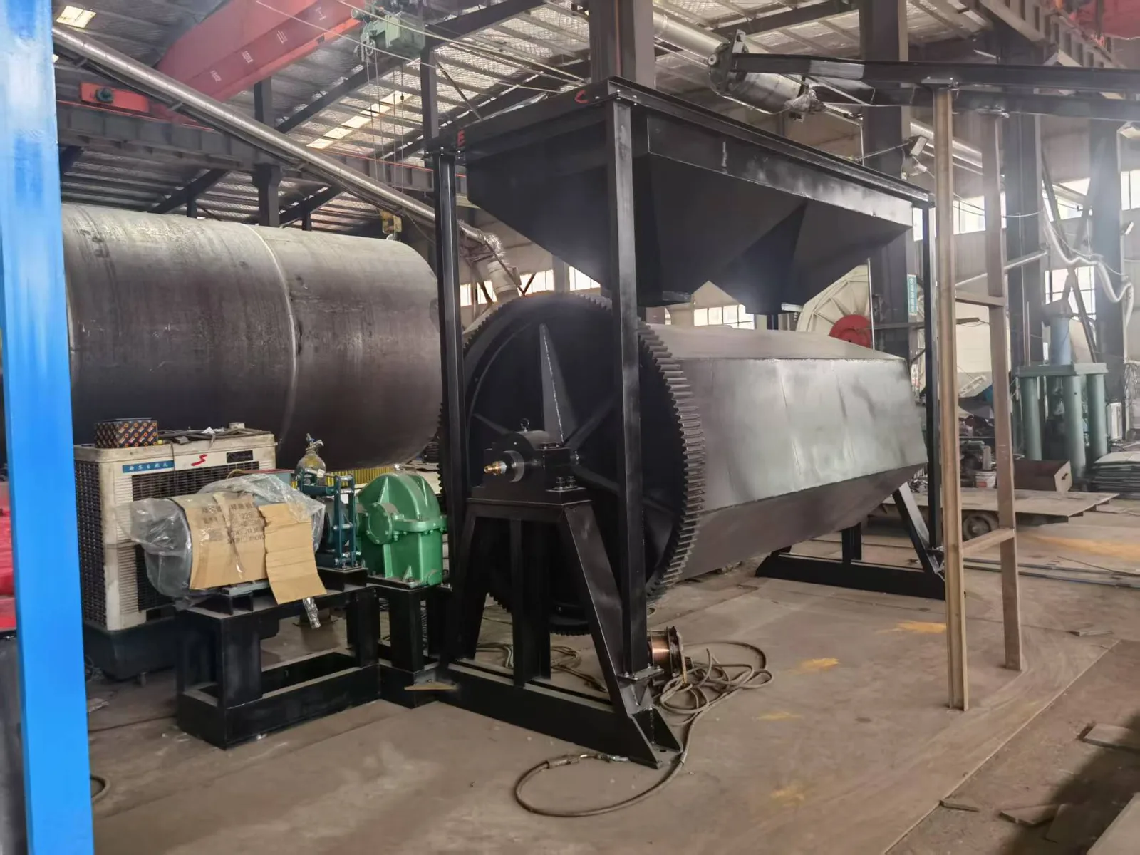 Heavy-duty cobblestone polisher being assembled inside the manufacturing workshop